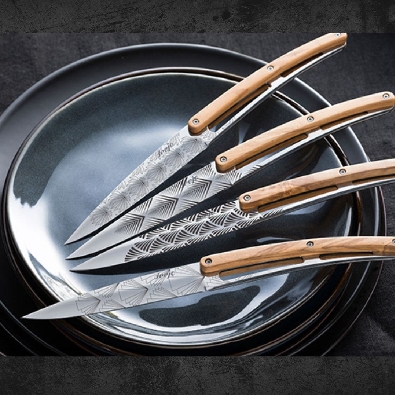 Deejo
Engraved Steak Knives 
w/ Wood Handles
Set of 4

The tat...